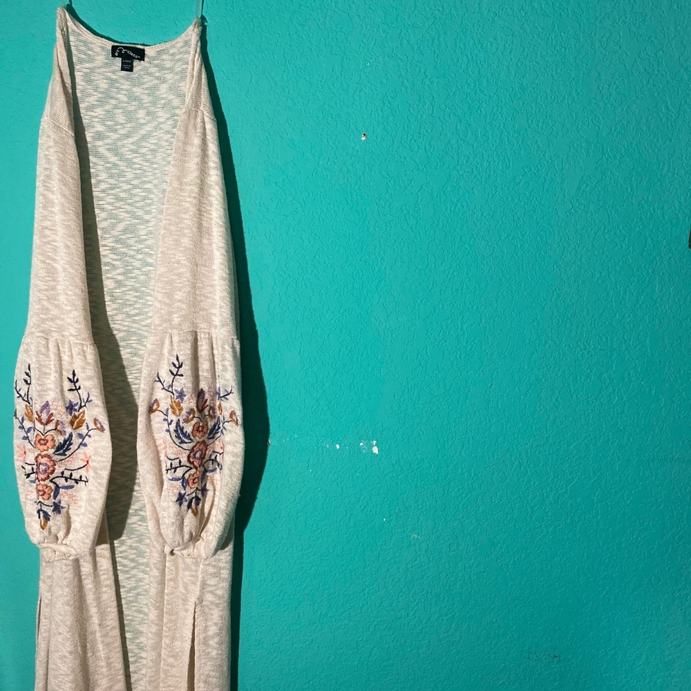 White cardigan with embroidered flowers on sleeves